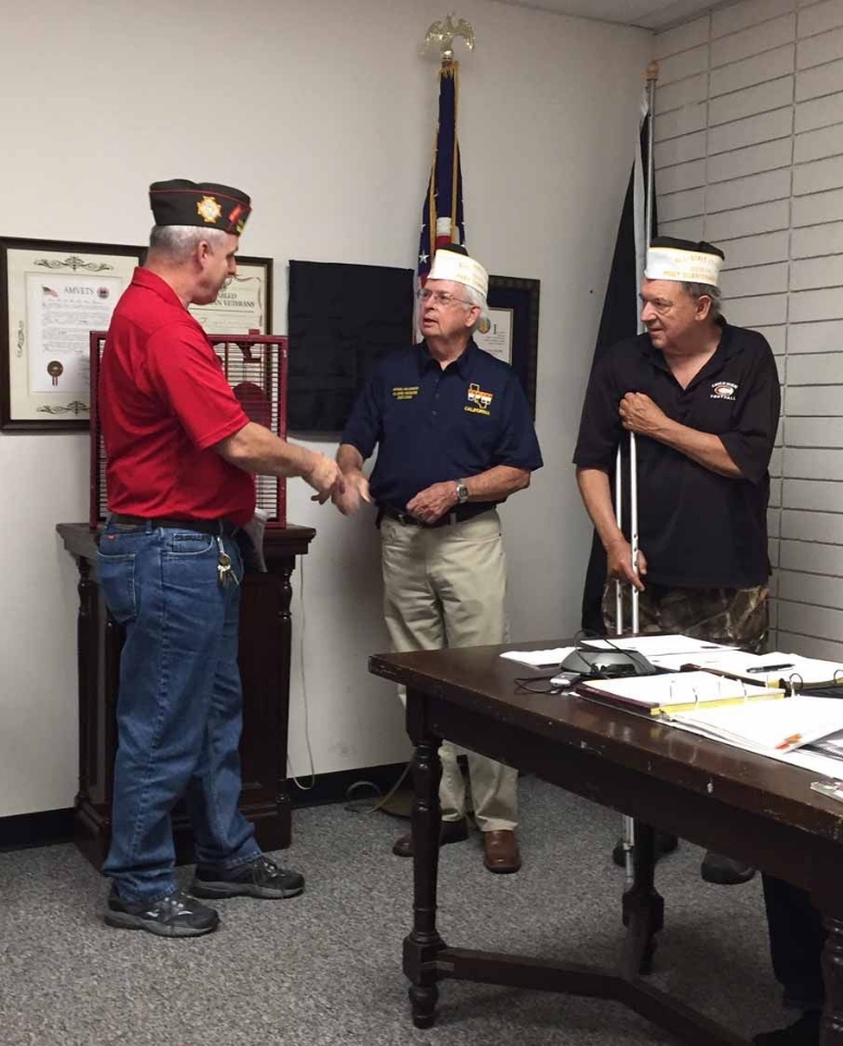 Commander Mike Halldorson and Quartermaster Mike Hall receive the All State Post Award from Jerry Brady, State Adjutant.